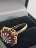 9k Hallmarked gold ring , red stone flower - 3.7 grams size o
