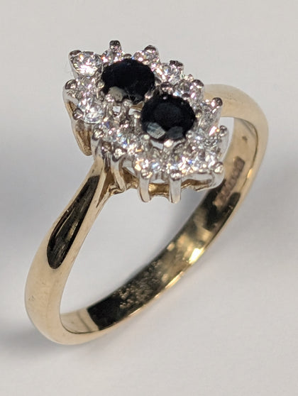 9ct gold ring with black stones