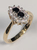 9ct gold ring with black stones