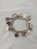 Silver Bracelet with 14 Charms (925 Hallmarked), 58.53Grams, Box Included, Approx., 8" Length