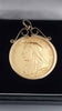 22ct Full Sovereign (7.9g) in 9ct mount/ chain (1.5g) holder. Year 1899
