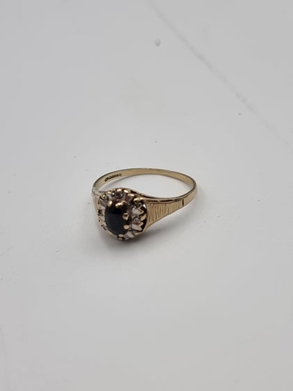 9CT Yellow Gold Ring With Black Stone And Diamond Stones - Size S - 2.43 Grams