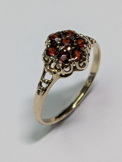 9CT GOLD RING  WITH DARK RED STONES