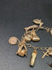 9ct Yellow Gold Charm Bracelet With 14x Charms - 16.19 Grams