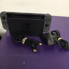 Nintendo Switch with dock and cables.