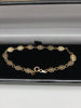 9K HALLMARKED (375) GOLD flower bracelet , 2.2grams