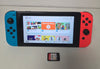 Nintendo Switch Neon Red/Neon Blue Boxed with 128gb Memory card & 1 Loose Game