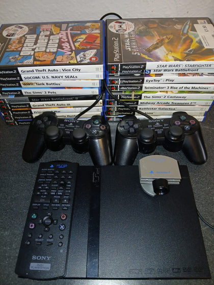 PS2 Slim console with cables, 18 games, multimedia remote and eye toy