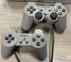 * PlayStation 1 with 2 controllers