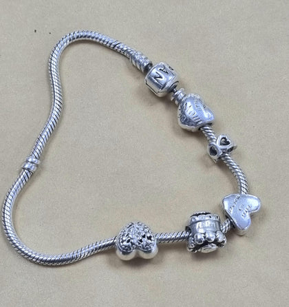 PANDORA BRACELET + 5 CHARMS