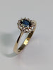9ct gold diamond ring with blue centre stone