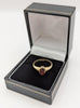 375 9CT HALLMARKED, YELLOW GOLD, RING WITH RED STRONE EMBEDDED, 2.1G, SIZE6.5/N