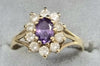 9ct gold ring with clear & purple stone