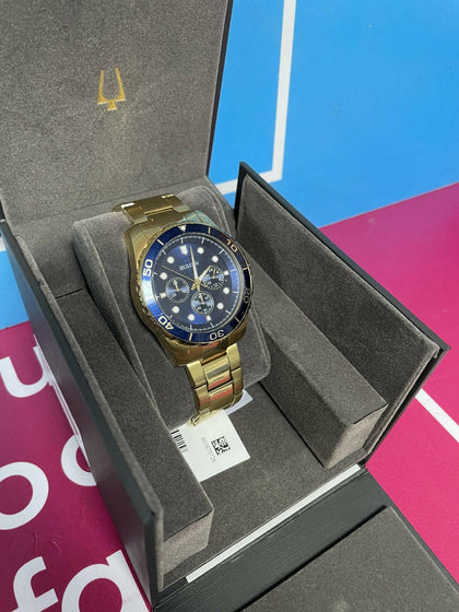 BULOVA BLUE AND GOLD STAINLESS STEEL WATCH.