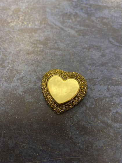 Silver heart pendant.
