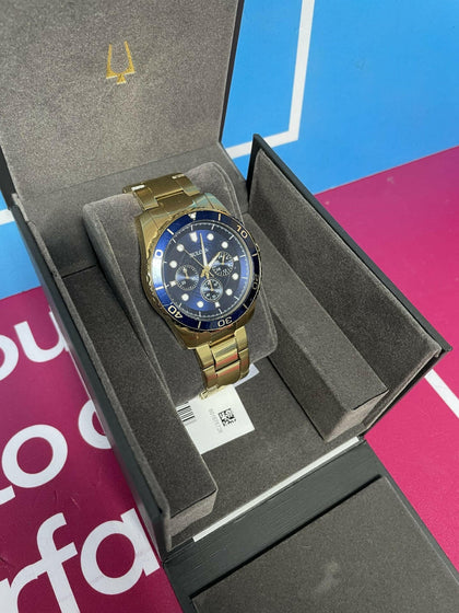 BULOVA BLUE AND GOLD STAINLESS STEEL WATCH.