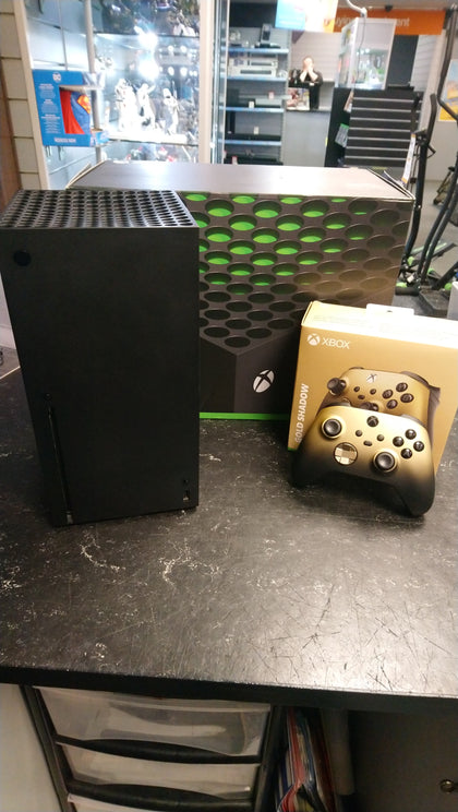 Xbox Series x 1TB Console with Gold Shadow controller.