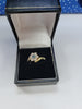 9CT Yellow Gold Ring With 6 Clear Stones And 1 Blue Stone - 3.26 Grams - Size Q