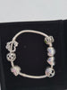 Pandora Bracelet with 6 Pandora Charms, Hallmarked 925 ALE, 29.35Grams, Approx. 7"