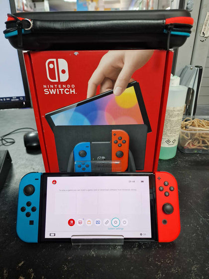 Nintendo Switch OLED - Neon Blue/Neon Red.